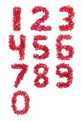 1, 2, 3, 4, 5, 6, 7, 8, 9, 0 Number Written with Pomegranate Fruit Seeds on White Background