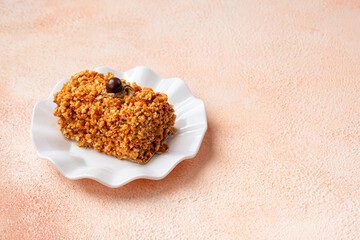 Mocha nougat caramel cake with chocolate chip on top