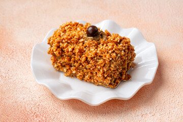 Mocha nougat caramel cake with chocolate chip on top