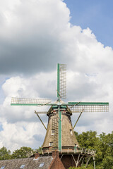 Floor windmill in the center of village Norg in Municipality Noordenveld in the Netherlands. Traditional Esdorp in Northern Drenthe.