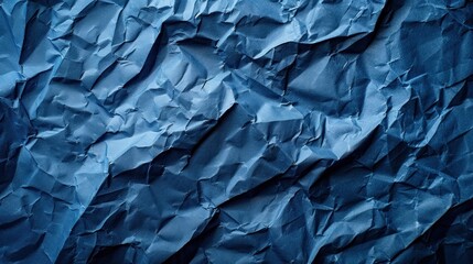 Fototapeta premium A blue paper with a rough texture. The paper is crumpled and torn, giving it a sense of chaos and disorder