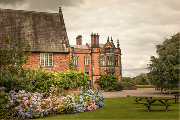 Gardens with borders of flowers and benches
