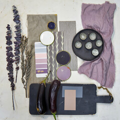 top view of material collage, color palette, mood board for interior design and decor in purple...