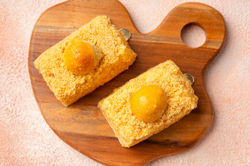 Nastar Cake is vanilla sponge based with crumbs, layered by pineapple jam and cheese cream. Topping with nastar cookies crumbs