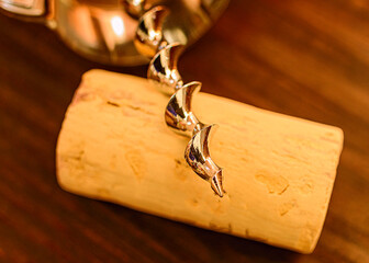 Cork and Corkscrew on Dark Wood