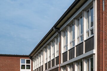 House facade with windows in a row of an office building