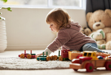 Young kid, toys and play in bedroom for development or learning, child in home for motor skills....