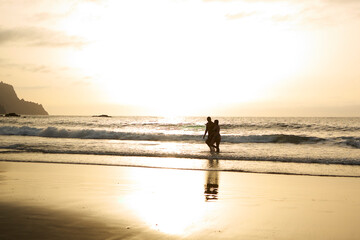 couple walking on the beach