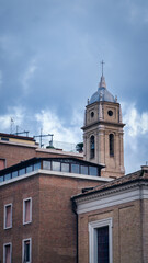 A view across the rooftops of Rome at sunset on a winter day. Domes of old church