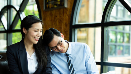 Chasing after success with the best connection. Shot of two business people Success Business couple in love enjoying and relaxing at home office in a relaxed atmosphere after successful online working