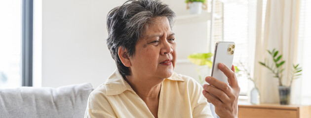 Elderly woman have eyesight problem can not read because seeing text blurred and headache from eye...