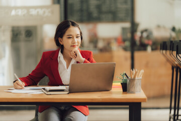 Business woman happily working in the office