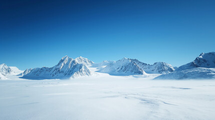Fototapeta premium Clear blue sky over dramatic snow-covered mountain