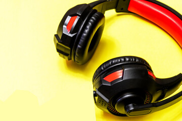 Wireless Over-Ear full size Headphones, Black leather isolated on yellow background with clipping...