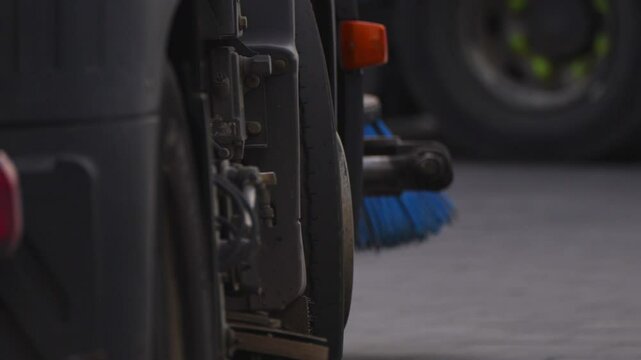 vacuum sweeper driving down the road