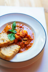 Portion of Livorno fish stew with toast