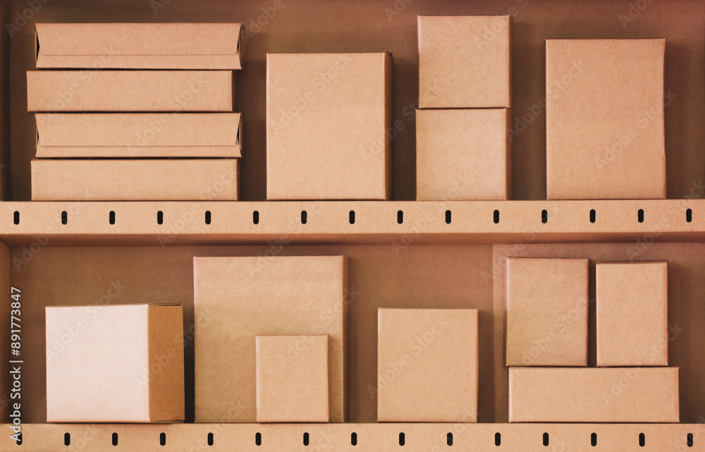 Poster A shelf full of cardboard boxes with a variety of sizes and shapes. The boxes are stacked on top of each other, creating a sense of depth and organization. The image conveys a feeling of abundance