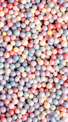 multicolored styrofoam balls texture background, colorful bubble filler. Background, holiday