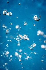 Wallpapers with whater drops in air with bubbles, blue background.