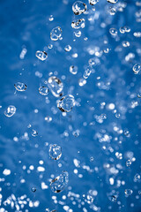 Wallpapers with whater drops in air with bubbles, blue background.