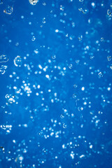 Wallpapers with whater drops in air with bubbles, blue background.