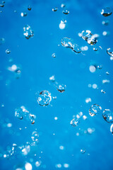 Wallpapers with whater drops in air with bubbles, blue background.
