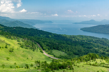 Fototapeta premium landscape with highway passing around lake and mountains