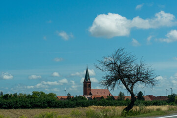 Beautiful minimalistic landscape of a European village overlooking a medieval church. High quality photo