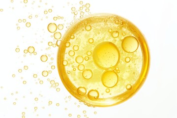 Fototapeta premium A yellow liquid with bubbles in it. The bubbles are small and scattered throughout the liquid. The liquid appears to be a type of oil or cream