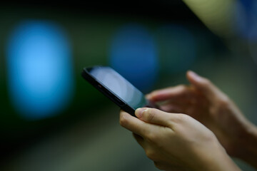 Mobile phone in female hands. 