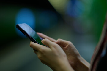 Mobile phone in female hands. 