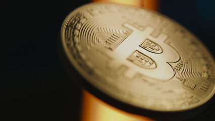 Slow motion of spinning golden bitcoin coin. Digital cryptocurrency virtual money. Blockchain...