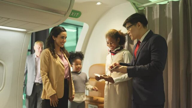 Air hostess man and woman stand in front of gate of airplane to welcome and service the customers before take of from airport.