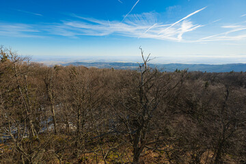 Obraz premium Beautiful view of mountain range covered with fog seen from viewing tower at sunny morning at winter