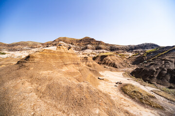 Surreal Badlands Sandstone Formations near Drumheller, Land of hoodoos, multi-hued canyons and geological erosion sculptured by water and wind