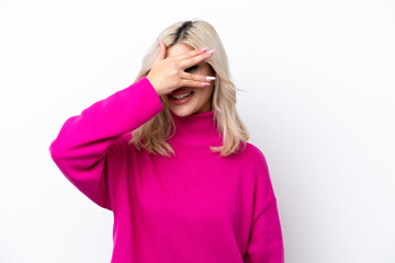 Young Russian woman isolated on white background covering eyes by hands and smiling
