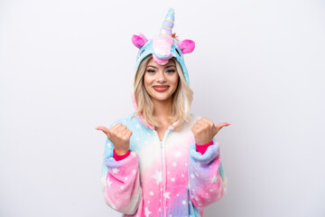 Young Russian woman with unicorn pajamas isolated on white background with thumbs up gesture and smiling