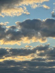 Evening clouds on the blue sky 