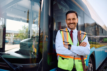 Happy city bus driver at the station looking at camera. © Drazen