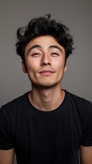 Fototapeta premium Young man smiles at the camera