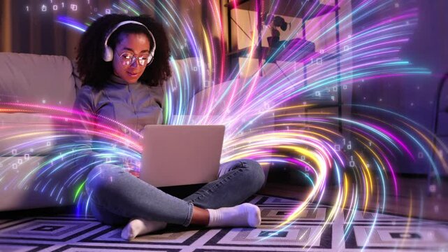 A woman is sitting on the floor, interacting with a laptop computer. Visualisation of information flows that fill the space