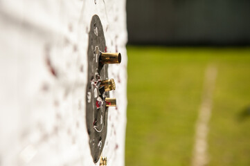 Old practice shooting target, damaged gun, bullet traces