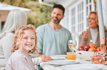 Child, portrait and family with lunch outdoor for holiday celebration, brunch and waiting for food with bonding. Girl, people and dinner event on patio in festive season with relax, fun and happy