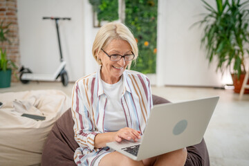 One woman mature caucasian female use laptop computer for work