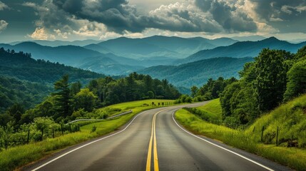 Naklejka premium Scenic drive towards the Great Smoky Mountains National Park, Tennessee, showcasing a long road through rich green landscapes
