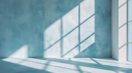 Obraz premium Minimalist abstract light blue background designed for product presentations, featuring shadows and light effects from windows on a plaster wall.
