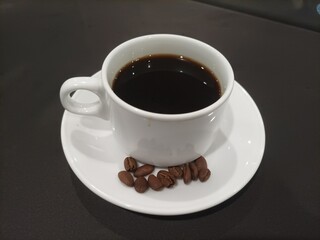 cup of coffee with beans