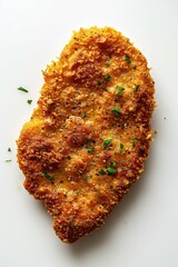 A close-up photograph of a breaded chicken cutlet ready for frying, crispy and well-seasoned, top-down view.