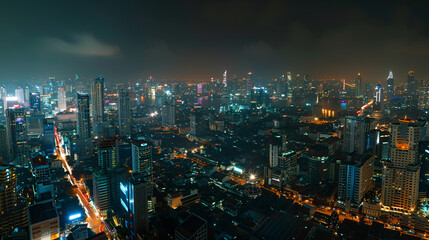 Fototapeta premium Panoramic view of Bangkok's bustling business district at night, illustrating the cityscape illuminated with lights and skyscrapers, portraying urban vibrancy and economic activity.