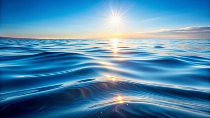 Obraz premium Serenely undulating blue water surface with gentle wave patterns and subtle sunlight reflections creating a calming abstract oceanic background.